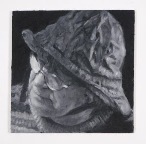 tableau peint à l'encaustique représentant le visage d'un homme avec un chapeau de pêche.